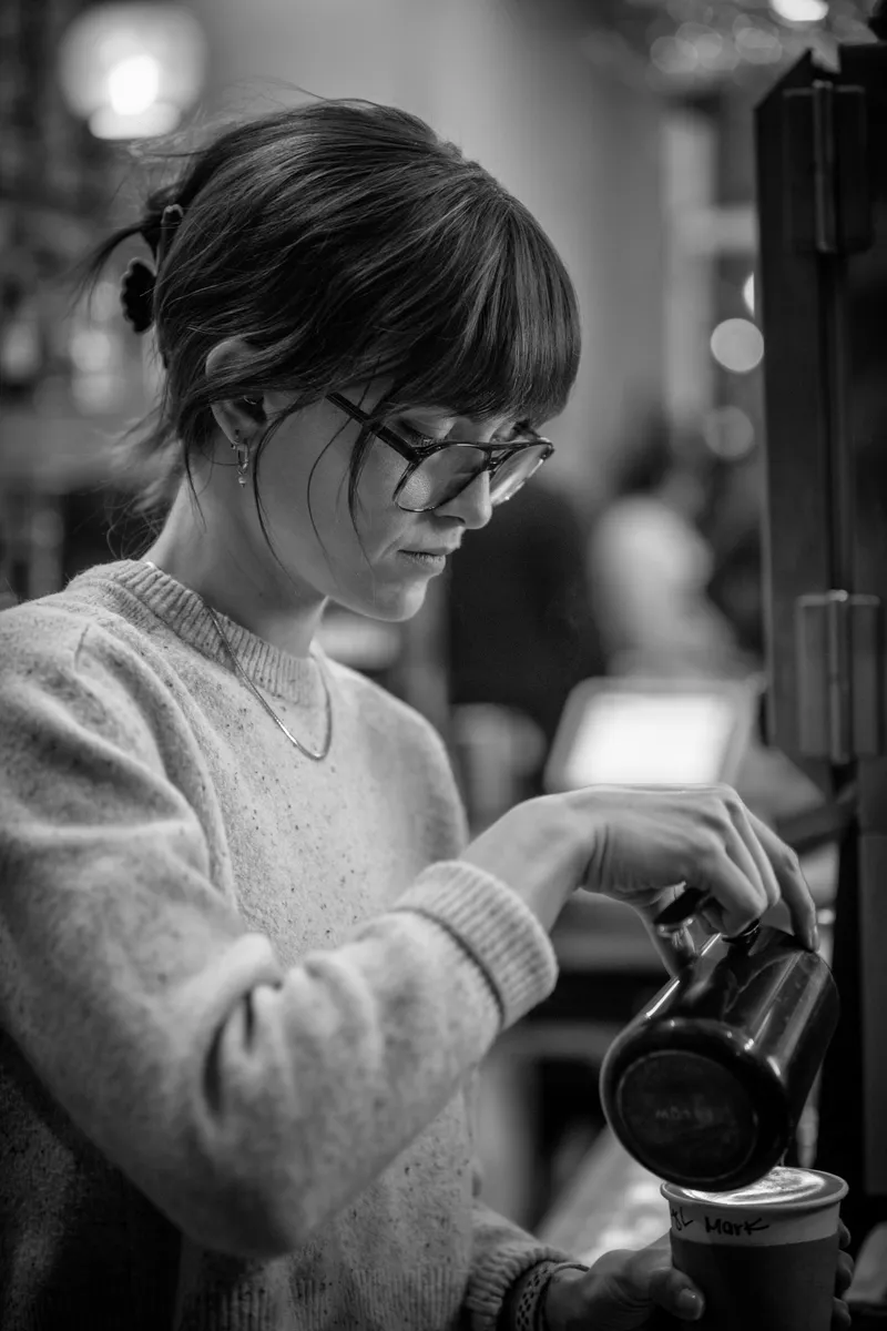 Kira working as a barista